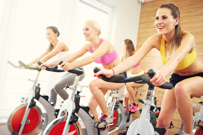 Sporty women on spinning class