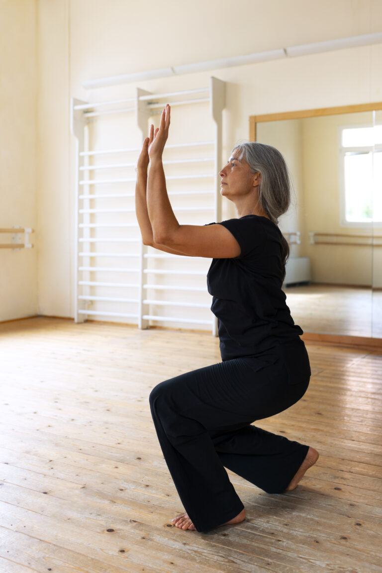 full-shot-senior-woman-dancing-studio